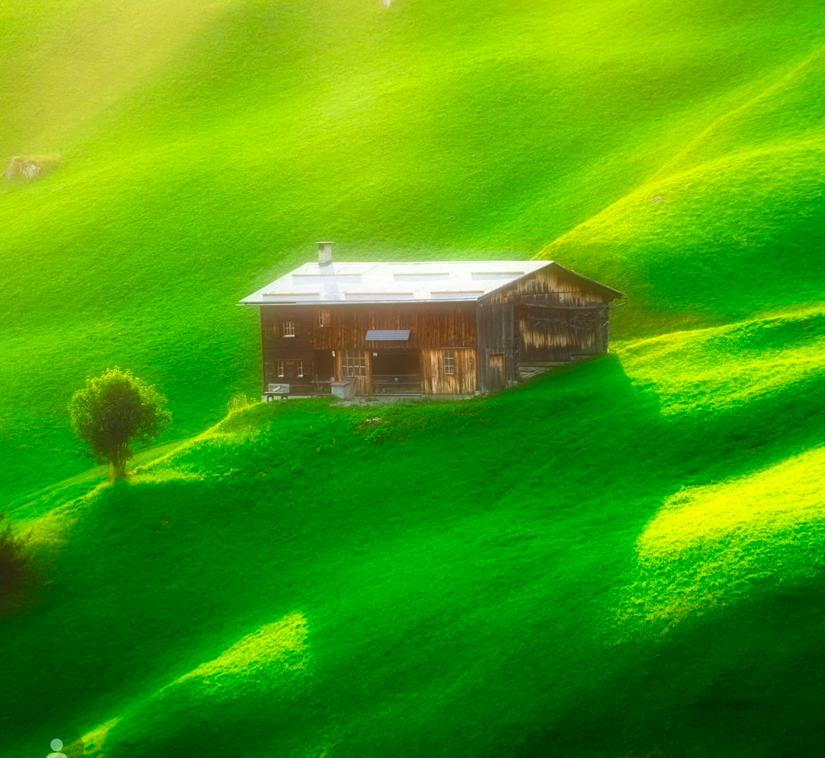 photo of house against lush green landscape by Inder Mokha