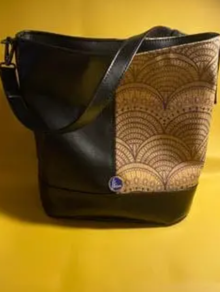Black and tan patterned handbag made by Ila Allen of Allen Designs