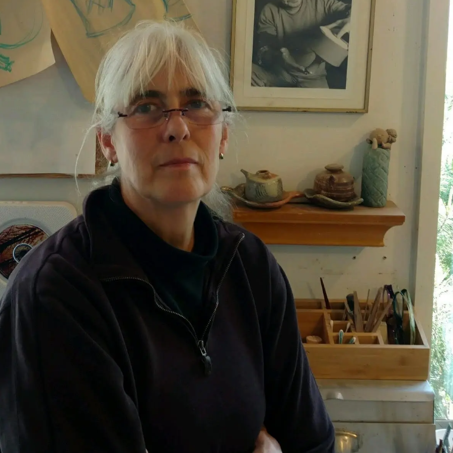 Anne Maravigilia standing in her ceramics studio